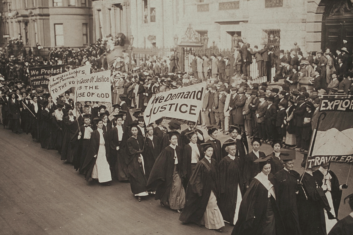 Women in academic dress marching in a suffrage parade in New York City, 1910.