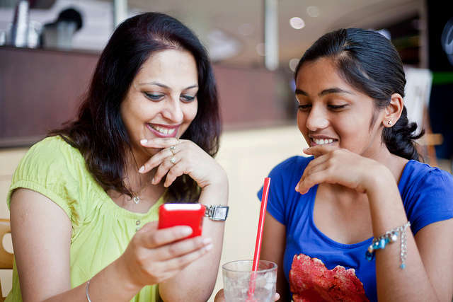 adult woman and young girl in conversation