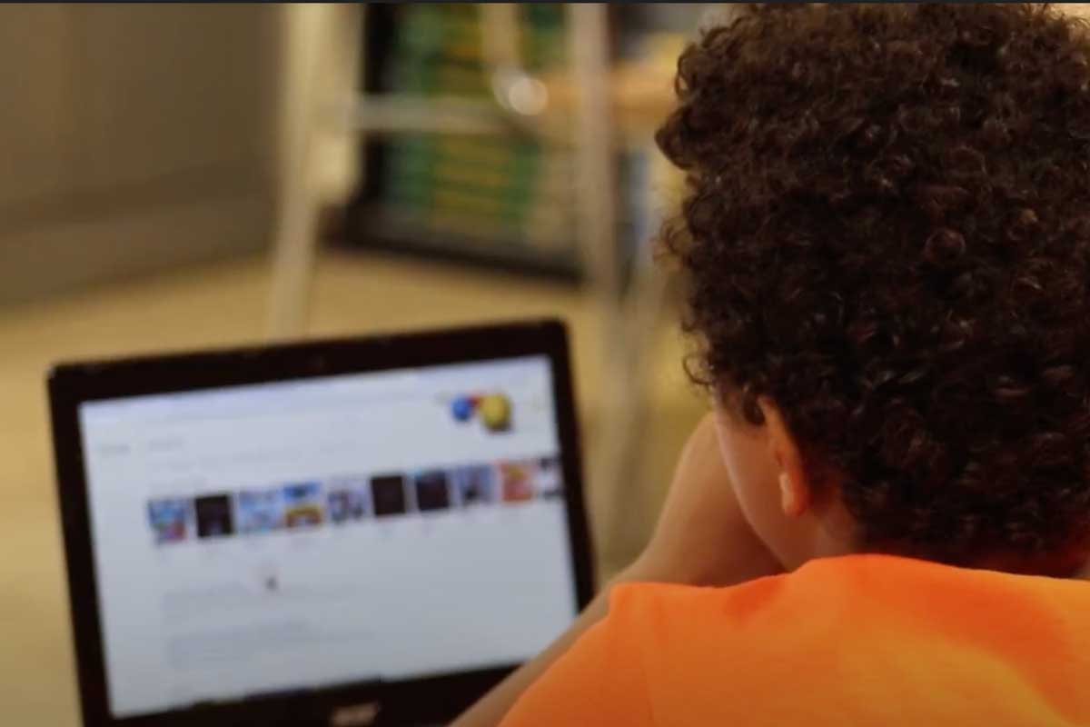 middle school student uses laptop during summer workshop on digital wellbeing