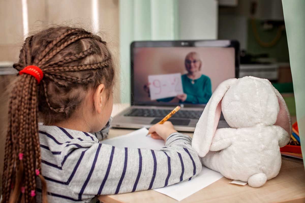 Young girl attends online class