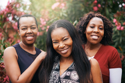 3 women of color smiling together