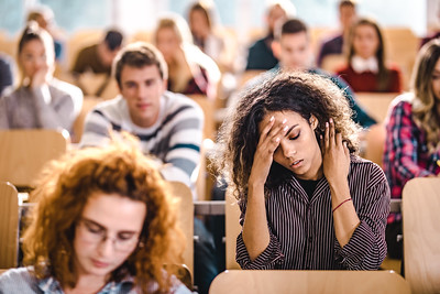 Student in a classroom stressed