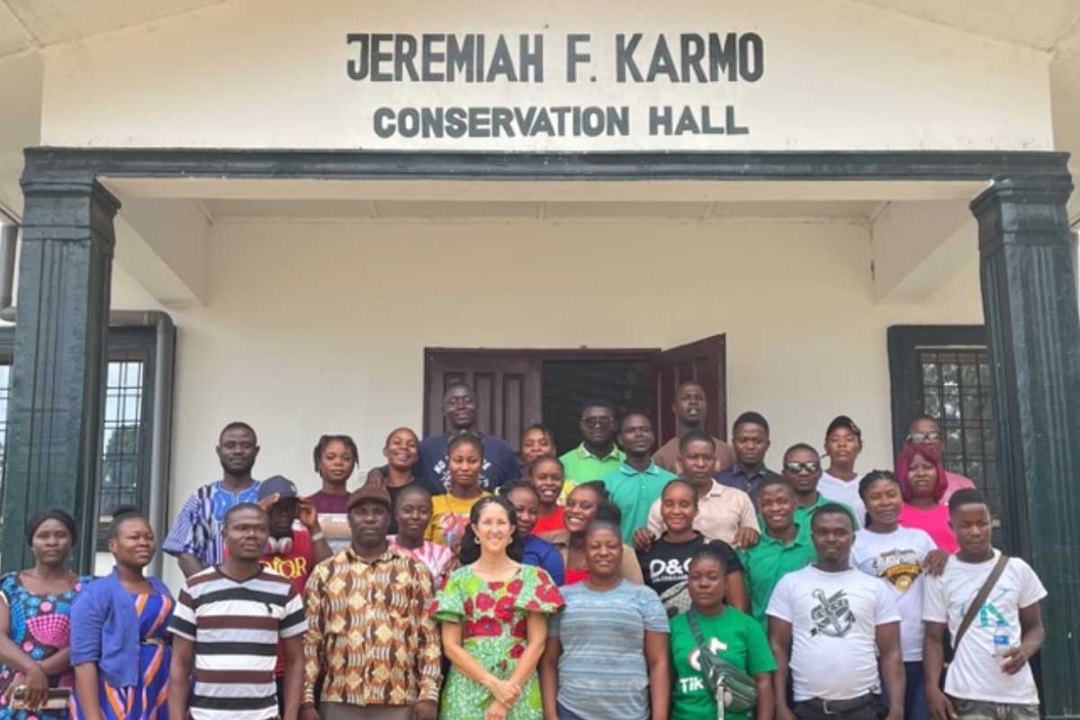 Group of students and staff with Layli Maparyan at Jeremiah F Karmo Conservation Hall