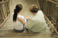 Counselor comforts student