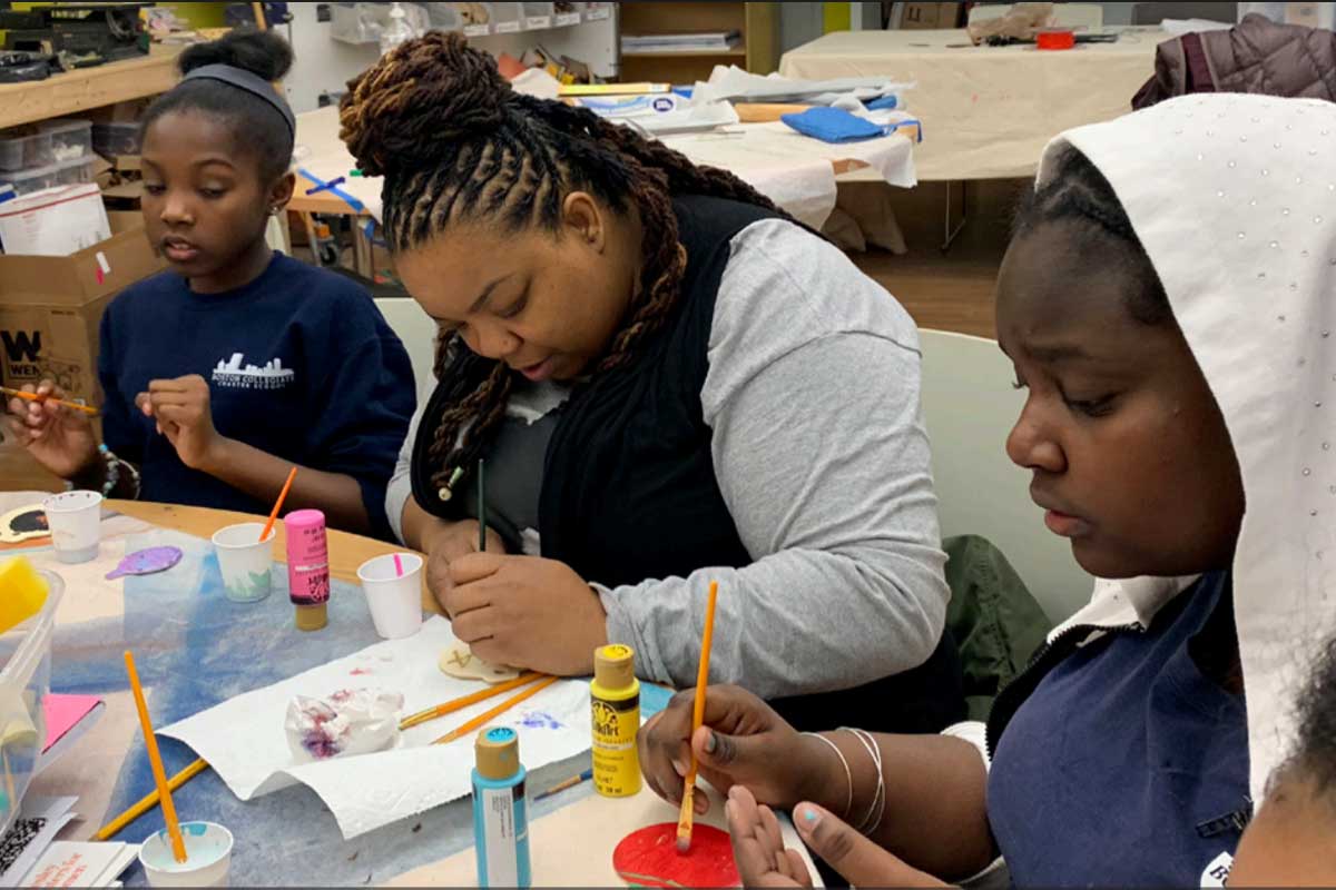 A meeting of Black Girls Create, a culturally responsive STEM program created by LaShawnda Lindsay, Ph.D. (center)