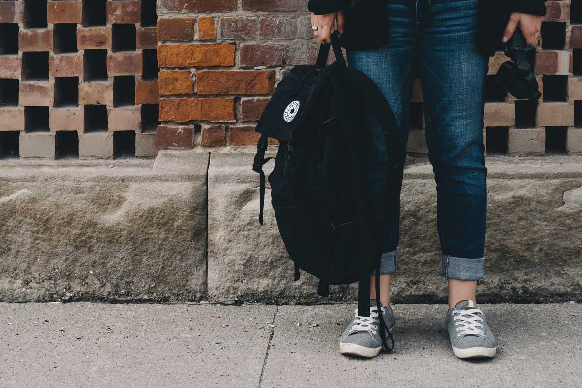 Student holding backpack