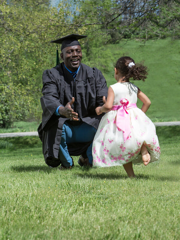 A father greeting his daughter on his graduation day 