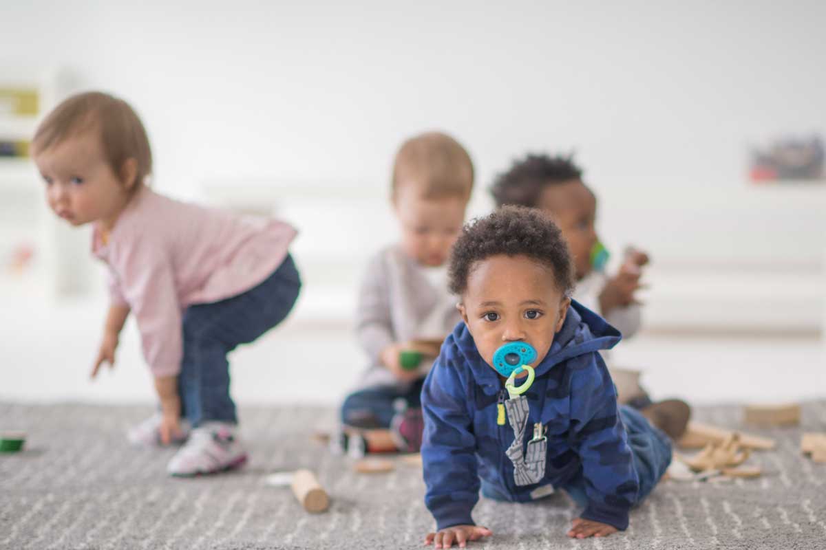 Infants crawl and walk in child care setting