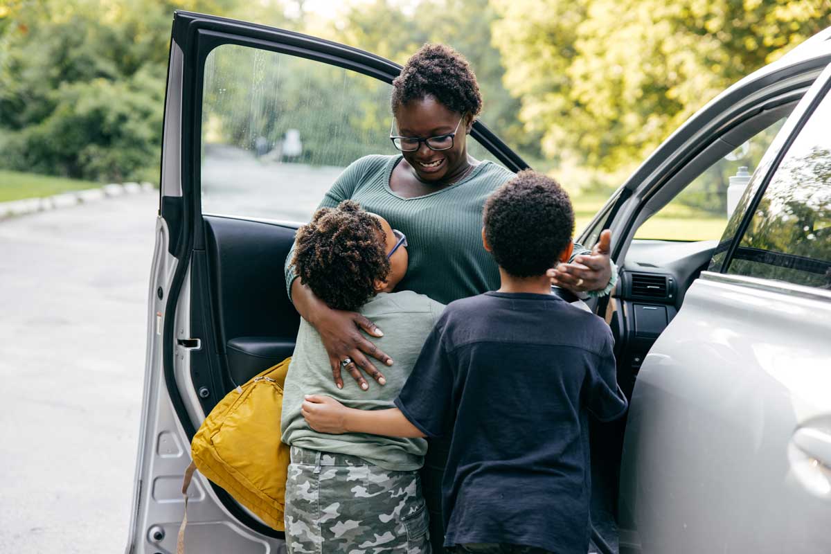 mom hugs kids